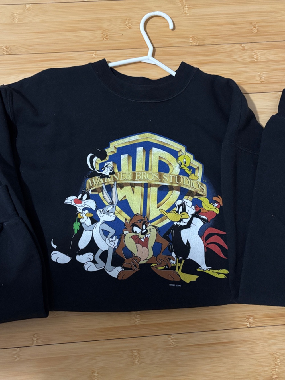 Warner Bros. Black Crewneck Sweater with Looney Tunes Shield Graphic